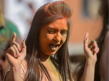 Ravens Dhillon dances while celebrating the festival of Holi at Lloyd Park in Calgary, AB., on Saturday, March 26, 2016. Holi, also known as the festival of colours, is a spiritual Hindu festival that marks the arrival of spring.