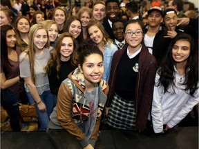 Juno award nominee Alessia Cara has her photo taken with students at Lord Beaverbrook High School after performing in Calgary, Ab., on Thursday March 31, 2016 and helping to present the school's music program with a $10,000 grant.