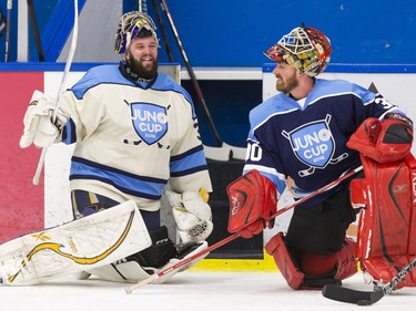 Andrew O'Brien (L) of folk duo Fortunate Ones chats with fellow musician Jonathan Roy before a Juno Cup practice game at Max Bell Centre in Calgary, Alta., on Thursday, March 31, 2016. Musicians and former NHLers were prepping for the Juno Cup hockey game set for this Friday, part of events leading up to the Juno Awards on Sunday at the Saddledome. Lyle Aspinall/Postmedia Network