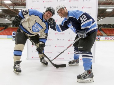 NHL alum Mark Napier (L) and country artist Gord Bamford mug for a photo before a Juno Cup practice game at Max Bell Centre in Calgary, Alta., on Thursday, March 31, 2016. Musicians and former NHLers were prepping for the Juno Cup hockey game set for this Friday, part of events leading up to the Juno Awards on Sunday at the Saddledome. Lyle Aspinall/Postmedia Network