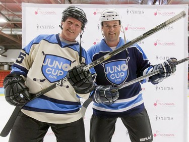 NHL alum Mark Napier (L) and country artist Gord Bamford mug for a photo before a Juno Cup practice game at Max Bell Centre in Calgary, Alta., on Thursday, March 31, 2016. Musicians and former NHLers were prepping for the Juno Cup hockey game set for this Friday, part of events leading up to the Juno Awards on Sunday at the Saddledome. Lyle Aspinall/Postmedia Network