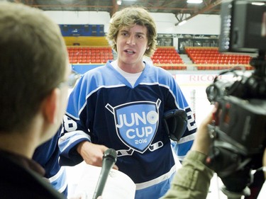 Musician Devin Cuddy, the son of Blue Rodeo frontman Jim Cuddy, speaks with Postmedia before a Juno Cup practice game at Max Bell Centre in Calgary, Alta., on Thursday, March 31, 2016. Musicians and former NHLers were prepping for the Juno Cup hockey game set for this Friday, part of events leading up to the Juno Awards on Sunday at the Saddledome. Lyle Aspinall/Postmedia Network