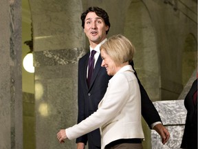 Prime Minister Justin Trudeau and Premier Rachel Notley walk together after a press conference in Edmonton on Feb. 3.