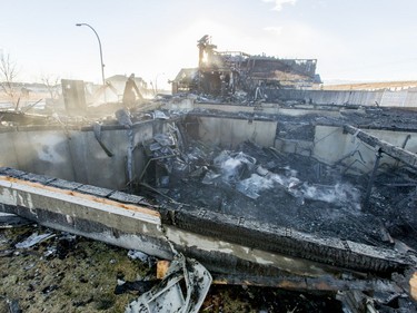 A burned-up home sits on Kincora Dr NW in Calgary, Alta., on Tuesday, March 8, 2016. Four homes went up in flames overnight, but no one was injured. Lyle Aspinall/Postmedia Network