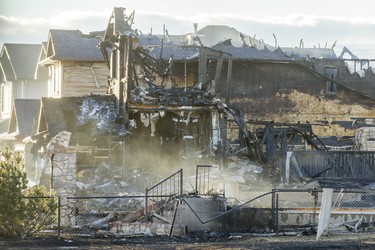 Charred remains of several homes can be seen on Kincora Drive N.W.
