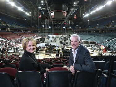 Lindsay Cox, supervising producer for Insight Productions, and Allan Reid, executive producer for CARAs sit in the stands on Tuesday as the Scotiabank Saddledome is transformed to host the 2016 Junos on Sunday. Gavin Young/Postmedia