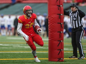 Mercer Timmis runs in a touchdown  during the fourth quarter action against UNC Thunderbirds at the Hardy Cup Canada West football championship at McMahon Stadium in Calgary on November 14, 2015. (Crystal Schick/Calgary Herald)