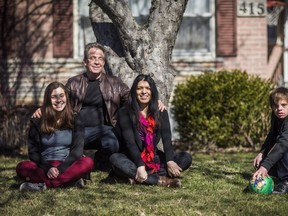 Nico Montoya, right, a 13-year-old boy with Down syndrome, poses with his sister Tania, left, his father Felipe, second left, and his mother Alejandra Garcia at his home in Richmond Hill, Ont., on Saturday, March 19, 2016.