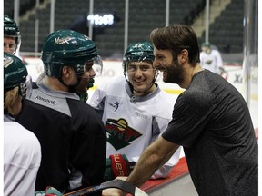 Niklas Backstrom reacquaints himself with old friends on his return to his old stomping grounds in Minnesota.