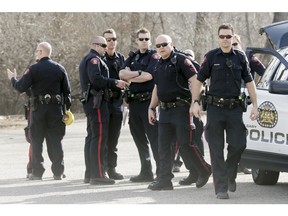 Police work at Stanley Park in Calgary, Alta., on Sunday, March 20, 2016.