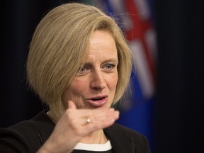 Premier Rachel Notley speaks to reporters prior to the reading of the throne speech.