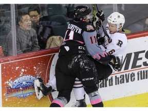 Calgary Hitmen Beck Malenstyn takes down Red Deer Rebels Nelson Nogier in WHL action at the Scotiabank Saddledome in Calgary, Alberta, on Sunday, March 6, Mike Drew/Postmedia ORG XMIT: 00072539A