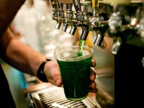 A green beer is poured from a tap, a staple of St. Patrick's Day. File photo