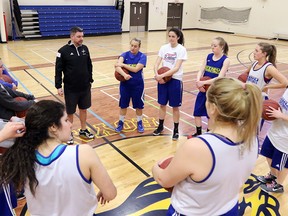 Coach Steve Shoults talks to the St. Mary's University women's basketball team before practice at Glenmore Christian Academy on Monday, March 14, 2016. The team are heading to their first ever Canadian Collegiate Athletic Association National Championship in Windsor, Ontario this week.
