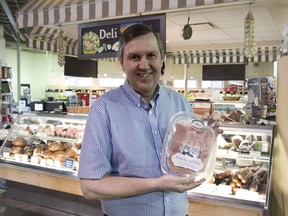 Sunterra Group president Ray Price holds a package of Italian prosciutto prepared at its new Balzac plant.