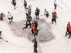 The Calgary Hitmen practice at the Stampede Corral in Calgary, Alta., on Thursday, March 31, 2016. They'll host the Red Deer Rebels there on Thursday for Game 4 of their playoff series, having been temporarily ousted from the Saddledome to make way for the Juno Awards.