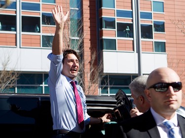 Prime Minister Justin Trudeau greets a throng of students before leaving SAIT Polytechnic in Calgary, Alta., on Tuesday, March 29, 2016. Trudeau was part of a roundtable discussion on employment insurance at the Kerby Centre before touring a carpentry lab at SAIT Polytechnic.