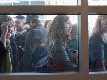 The crowd outside tries to get a glimpse of Justin Trudeau during a visit to SAIT Polytechnic in Calgary, Ab, on Tuesday, March 29, 2016.