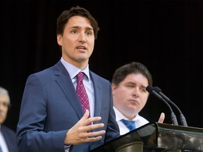 Prime Minister Justin Trudeau speaks to media at the Kerby Centre in Calgary, Alta., on Tuesday, March 29, 2016. Trudeau was part of a roundtable discussion on employment insurance at the Kerby Centre before touring a carpentry lab at SAIT Polytechnic.