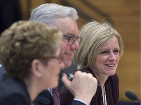 Alberta Premier Rachel Notley, right, Ontario Premier Kathleen Wynne and Manitoba Premier Greg Selinger are seen during the First Ministers meeting in Vancouver.