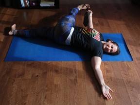 Yoga Instructor Johanna Steinfeld demonstrates the Supta Padagusthasana C pose.