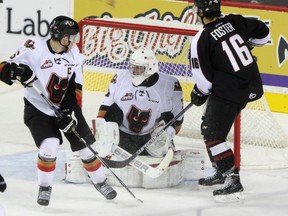 The loss of Calgary Hitmen captain Colby Harmsworth, left, who was suspended for a Game 2 hit on Red Deer forward Ivan Nikolishin, proved costly in the series for the Hitmen.