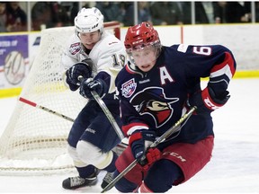 The Spruce Grove Saints' Brandon Biro (19) chases the Brooks Bandits' Shane Bear (6) during first period AJHL action at Grant Fuhr Arena, in Spruce Grove Alta. on Friday April 15, 2016. Photo by David Bloom