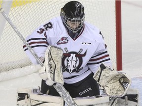 Crystal Schick/ Calgary Herald CALGARY, AB -- Red Deer Rebels goalie Rylan Toth makes a save during game action against the Calgary Hitmen at the Scotiabank Saddledome in Calgary, on November 23, 2014. --  (Crystal Schick/Calgary Herald) (For Sports story by  Laurence Heinen) 00060632A