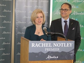 Premier Rachel Notley speaks with Finance Minister Joe Ceci by her side following a pre-budget consultation session at Centre 2000 on Thursday March 24, 2016 in Grande Prairie, Alta. The stop in Grande Prairie was one of several consultations sessions the government is conducting to get an idea of what issues are in different parts of the province before announcing the finalized budget in April. Jocelyn Turner/Grande Prairie Daily Herald-Tribune/Postmedia Network