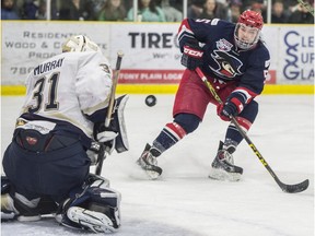 SPRUCE GROVE AB. APRIL 22, 2016 - Matthew Murray of the Spruce Grove Saints, makes the save on Joe O'Connor of the Brooks Bandits in Game 5 of their AJHL playoff series at Grant Fuhr Arena in Spruce Grove. Shaughn Butts / POSTMEDIA NEWS NETWORK