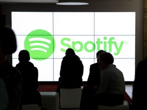 People wait for the start of an event by Spotify, the world leader in music streaming, in Berlin on May 20, 2015.The group reported they would soon begin streaming videos as well as music. AFP PHOTO / DPA / JÖRG CARSTENSEN  +++ GERMANY OUT +++Jörg Carstensen/AFP/Getty Image