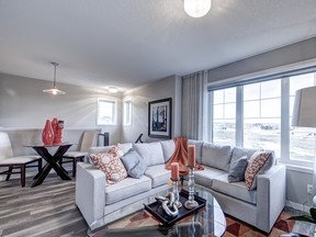 The great room in the Sonatina floor plan above the two-car garage, by Baywest Homes in Harmony.