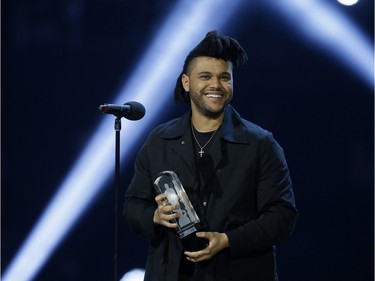 The Weeknd accepts the award for Single of the Year for his song Can't Feel my Face during the Juno Awards at the Scotiabank Saddledome in Calgary, Alta., on Sunday, April 3, 2016. The Juno Awards celebrate the best in Canadian music.