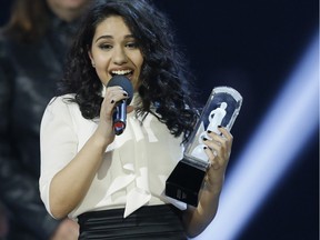Alessia Cara accepts the award for Breakthrough Artist of the Year during the Juno Awards at the Scotiabank Saddledome in Calgary, Alta., on Sunday, April 3, 2016. The Juno Awards celebrate the best in Canadian music.