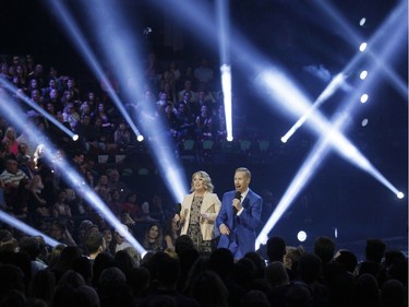 Co-hosts Jann Arden and Jon Montgomery speak during the Juno Awards at the Scotiabank Saddledome in Calgary, Alta., on Sunday, April 3, 2016. The Juno Awards celebrate the best in Canadian music.
