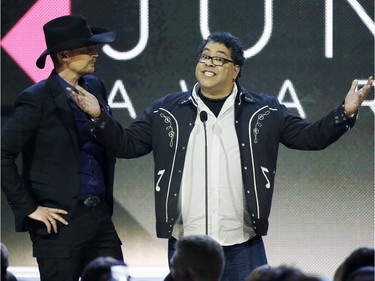 Paul Brandt and Calgary Mayor Naheed Nenshi present the Album of the Year Juno during the Juno Awards at the Scotiabank Saddledome in Calgary, Alta., on Sunday, April 3, 2016. The Juno Awards celebrate the best in Canadian music. Lyle Aspinall/Postmedia Network