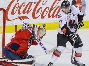 Calgary Hitmen's Jackson Houck, right, seen in action against the Lethbridge Hurricanes in February, played his last game for the Hitmen on Saturday and his hopingto break into pro hockey next season. Mike Drew/Postmedia