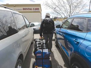 Peter Tombrowski heads home after shopping for his family of four at Costco. He makes the 40-minute round trip every week.