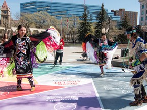 Dancers Gloria and Cameron Good Eagle and Shirley Hill perform at a gathering at Olympic Plaza to offer prayers for suicidal native youth across the country. Calgary, Ab., on Sunday April 17, 2016. (Mike Drew/Postmedia)