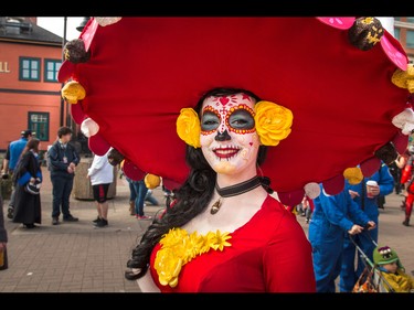 Amy Cooper aglow in red and yellow as La Muerte from The Book of Life at the annual Parade of Wonders that kicks off the Calgary Comic & Entertainment Expo at the BMO Centre in Calgary, Ab., on Friday April 29, 2016. Mike Drew/Postmedia