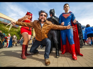 The Scarlet Witch (Jen Rey), Batman (Franz Miguel), Superman (Peter Fourlaris) and a snarling Wolverine (Dale Kliparchuk) at the annual Parade of Wonders that kicks off the Calgary Comic & Entertainment Expo at the BMO Centre in Calgary, Ab., on Friday April 29, 2016. Mike Drew/Postmedia