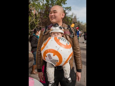 Little BB-8 - or is it Baby-8? - Eliana Liu with dad Jackie at the annual Parade of Wonders that kicks off the Calgary Comic & Entertainment Expo at the BMO Centre in Calgary, Ab., on Friday April 29, 2016. Mike Drew/Postmedia