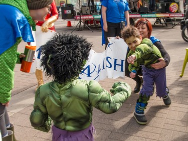 Little Hulk Julian Hartnett and mom Jeanine meet a fellow little Hulk at the annual Parade of Wonders that kicks off the Calgary Comic & Entertainment Expo at the BMO Centre in Calgary, Ab., on Friday April 29, 2016. Mike Drew/Postmedia