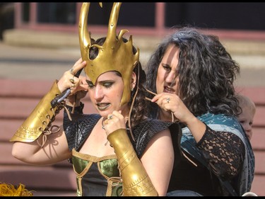 Bellatrix Lestrange - Stephanie Hauser - helps Loki - Susan Stroh - with her helmet at the annual Parade of Wonders that kicks off the Calgary Comic & Entertainment Expo at the BMO Centre in Calgary, Ab., on Friday April 29, 2016. Mike Drew/Postmedia