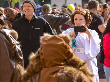 Princess Leia - Taryn Brenner - gets a picture of a couple of Ewoks at the annual Parade of Wonders that kicks off the Calgary Comic & Entertainment Expo at the BMO Centre in Calgary, Ab., on Friday April 29, 2016. Mike Drew/Postmedia