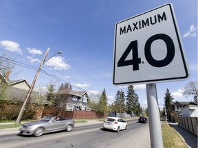 A 40 km/h sign sits on 30 Ave near 7 St SW in Calgary, Alta., on Saturday, April 16, 2016. City council is set to debate whether to lower residential speed limits to 30 or 40 km/h throughout the entire city.