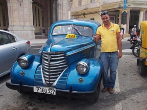 A Havana taxi driver proud of his refurbished ride. LISA MONFORTON, FOR THE CALGARY HERALD