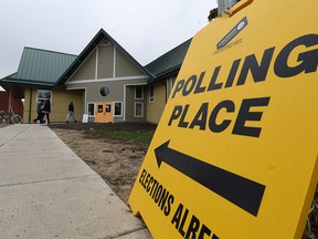 People vote in an Edmonton advance poll on Wednesday, April 29, 2015.