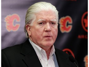 Brian Burke, Calgary Flames president of hockey operations, speaks to members of the media about Dennis Wideman being reinstated during a press conference  at the Scotiabank Saddledome in Calgary, Alta. on Friday March 11, 2016. Leah Hennel/Postmedia