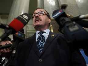 Progressive Conservative leader Ric McIver speaks to the media after the NDP delivered the 2016/2017 provincial budget at the Alberta legislature, in Edmonton on Wednesday, April 14, 2016.